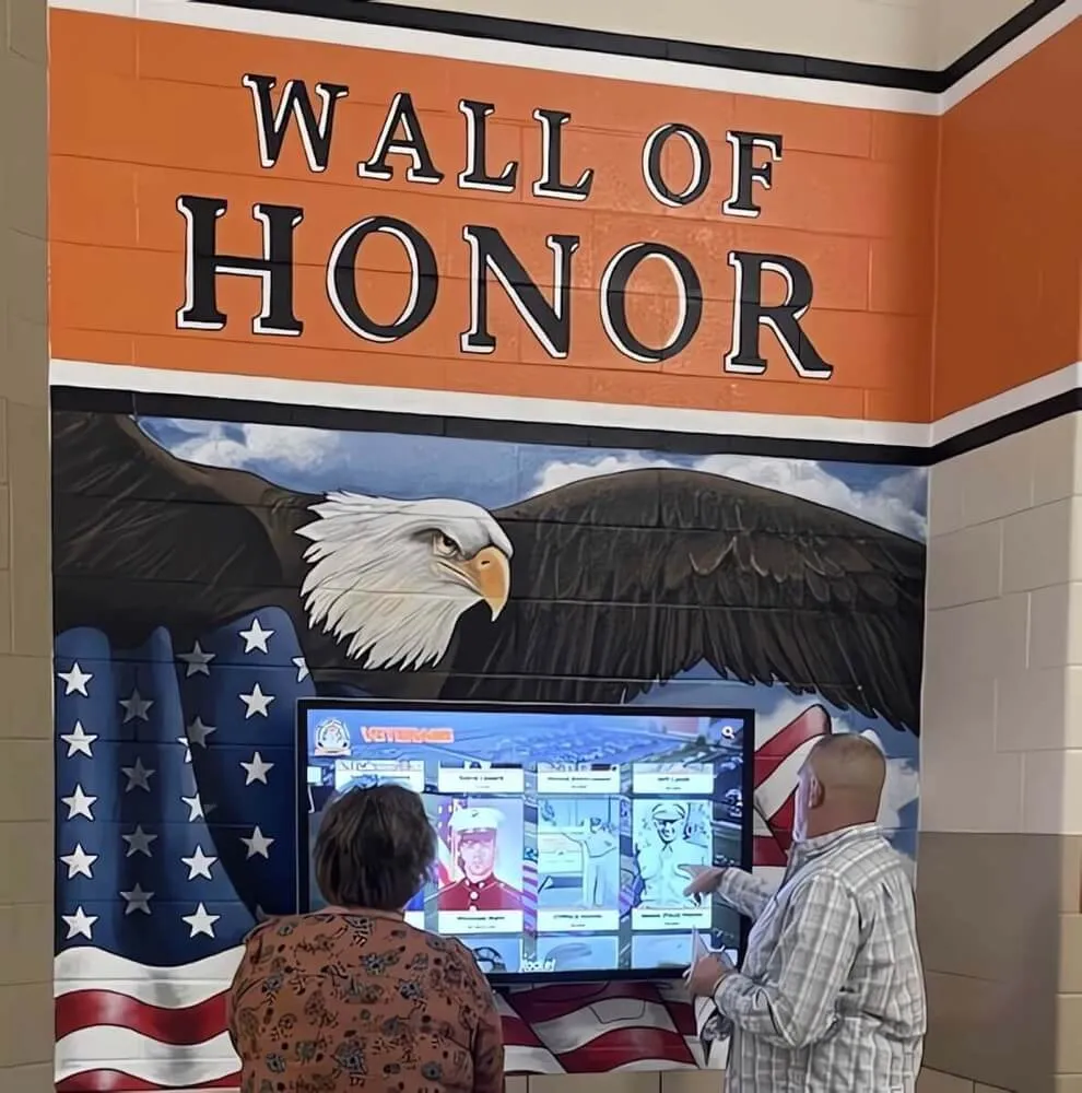 Veterans memorial with eagle, flag, and interactive display Veterans memorial display